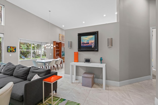 living room featuring a towering ceiling