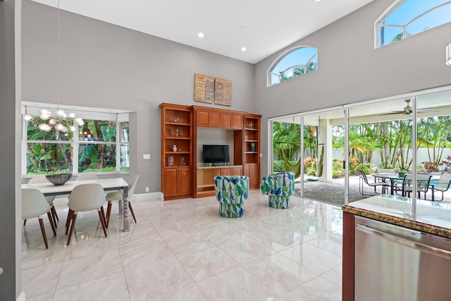 living room with high vaulted ceiling and ceiling fan