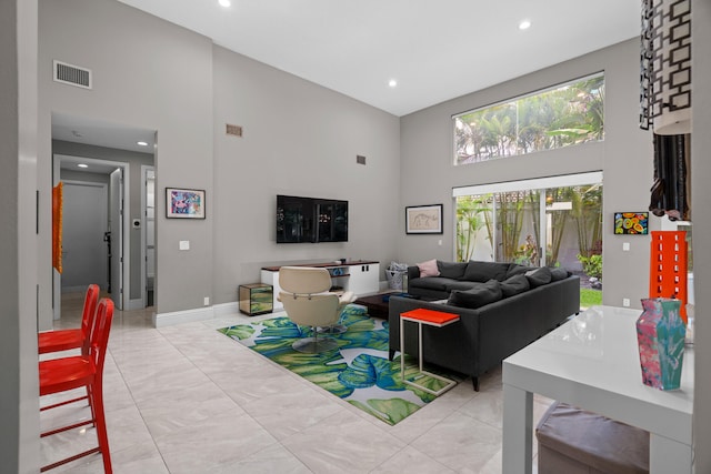 living room with a high ceiling