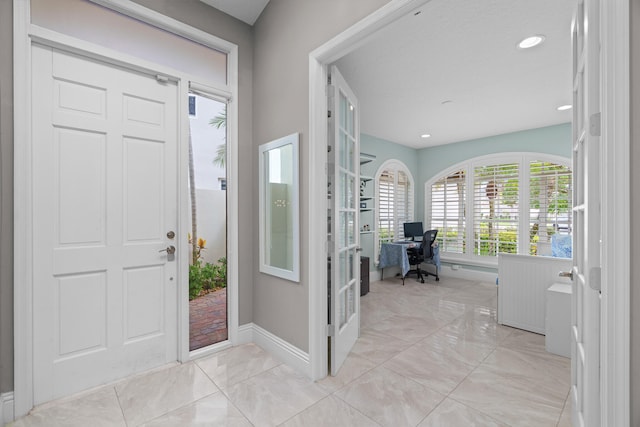 entryway featuring french doors