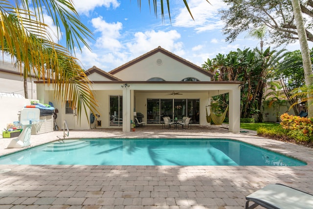 view of pool featuring a patio and ceiling fan