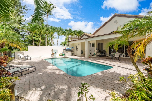 view of swimming pool with a patio