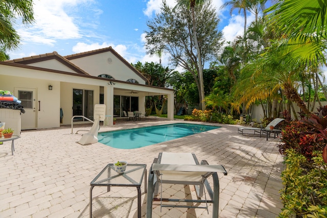 view of swimming pool featuring a patio area