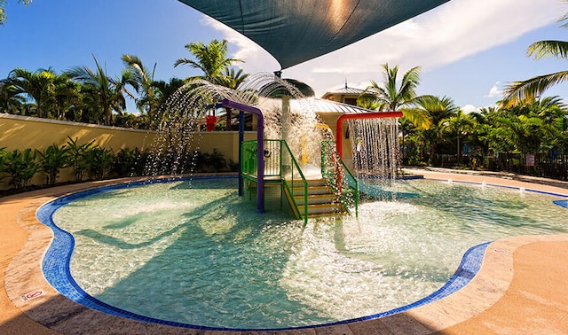 view of swimming pool featuring pool water feature