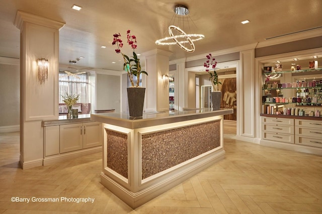 reception area featuring bar area and an inviting chandelier