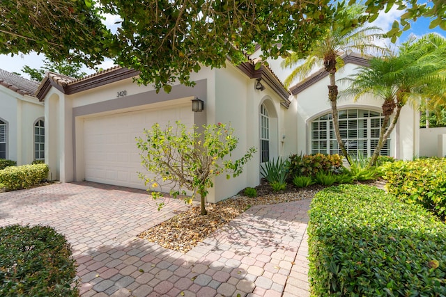 view of front of home with a garage