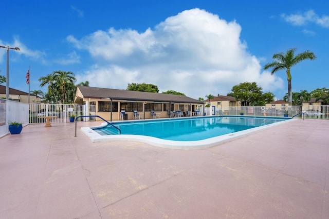 view of swimming pool featuring a patio area