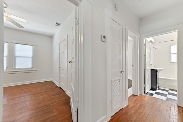 hall featuring dark wood-type flooring