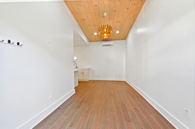 hall featuring a notable chandelier, hardwood / wood-style floors, wooden ceiling, and an AC wall unit