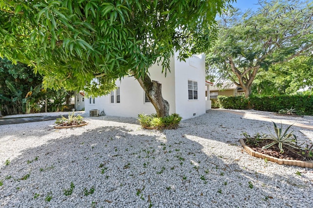 view of property exterior with central AC unit