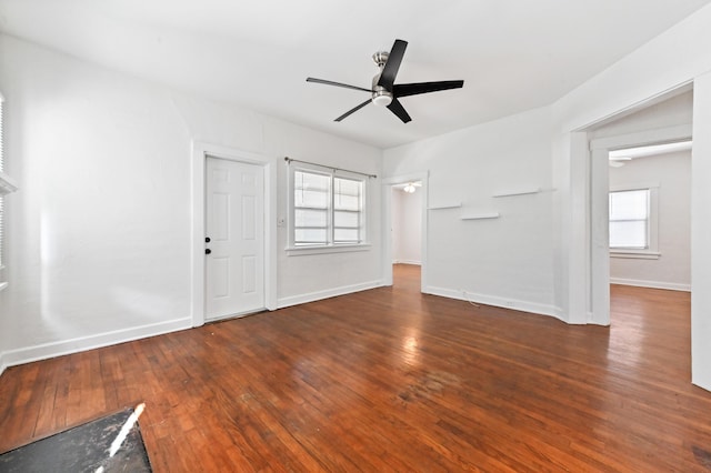 interior space with ceiling fan and dark hardwood / wood-style floors