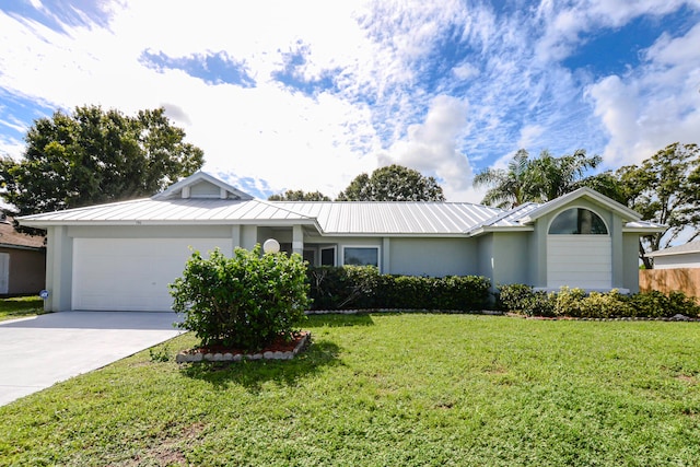 single story home featuring a garage and a front yard