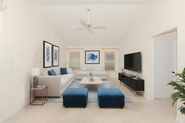 living room with a high ceiling, ceiling fan, and light carpet