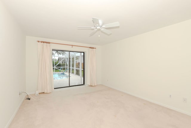 carpeted empty room with ceiling fan