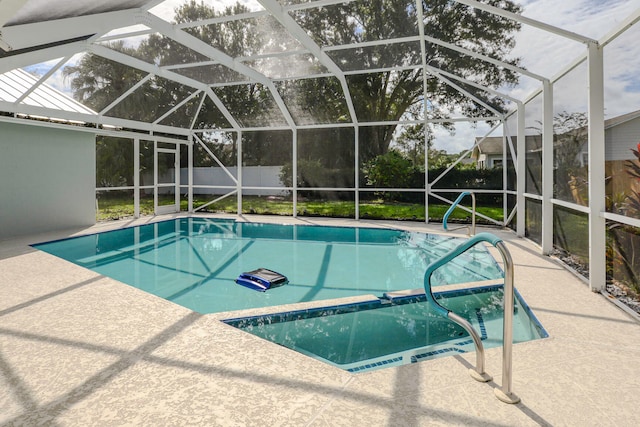 view of pool with a lanai and a patio