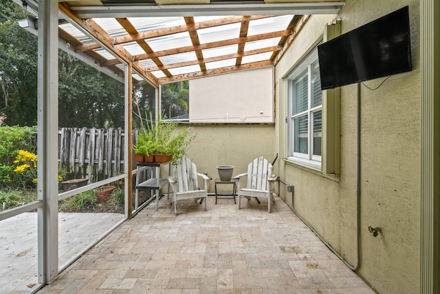 unfurnished sunroom with vaulted ceiling and a wealth of natural light