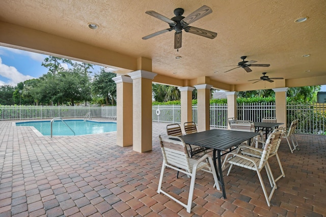 view of patio / terrace with fence and ceiling fan