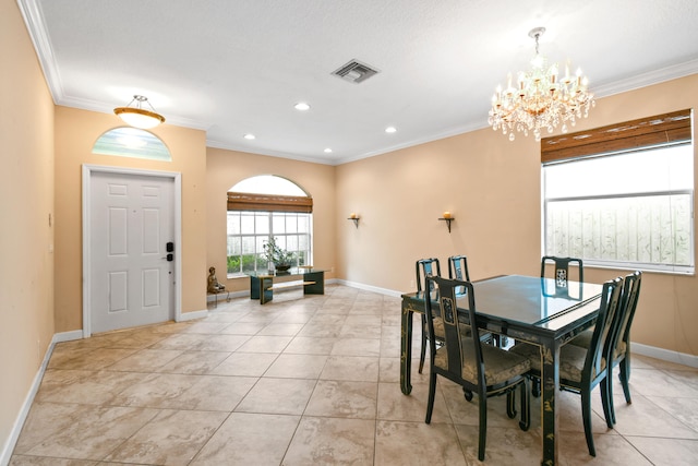 dining room with light tile patterned flooring, crown molding, and an inviting chandelier