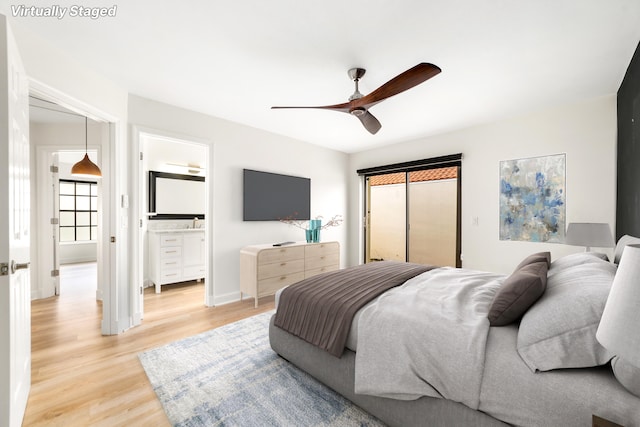 bedroom featuring ceiling fan, connected bathroom, and light hardwood / wood-style flooring