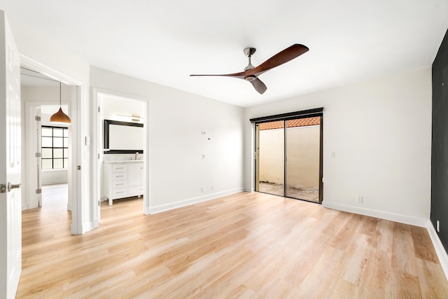 unfurnished bedroom featuring ensuite bath, ceiling fan, and light hardwood / wood-style flooring