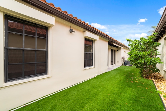 view of yard featuring central AC