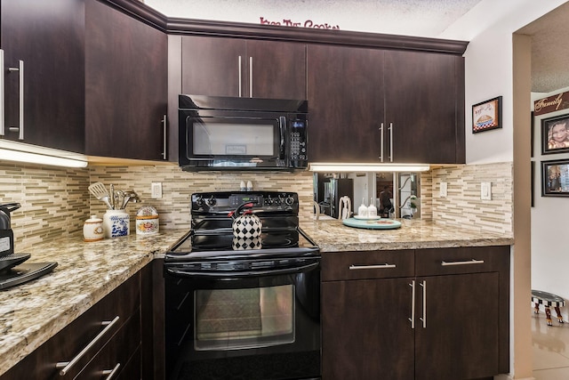 kitchen featuring backsplash, black appliances, light stone counters, and a textured ceiling