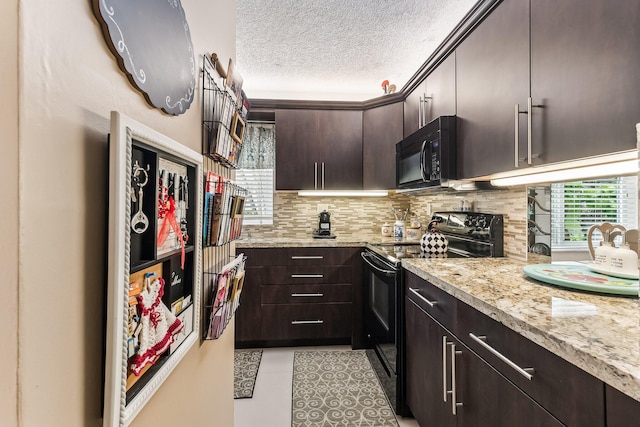 kitchen with light stone counters, black appliances, tasteful backsplash, dark brown cabinets, and a textured ceiling