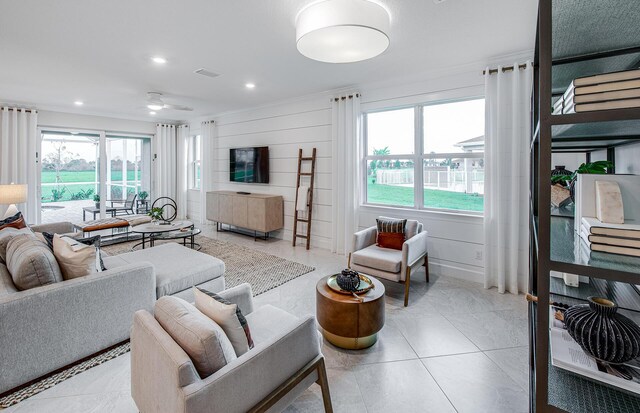 tiled living area featuring visible vents, a ceiling fan, and recessed lighting