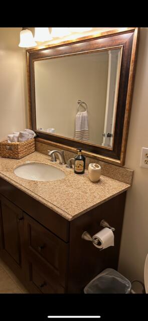 bathroom featuring vanity and tile patterned flooring