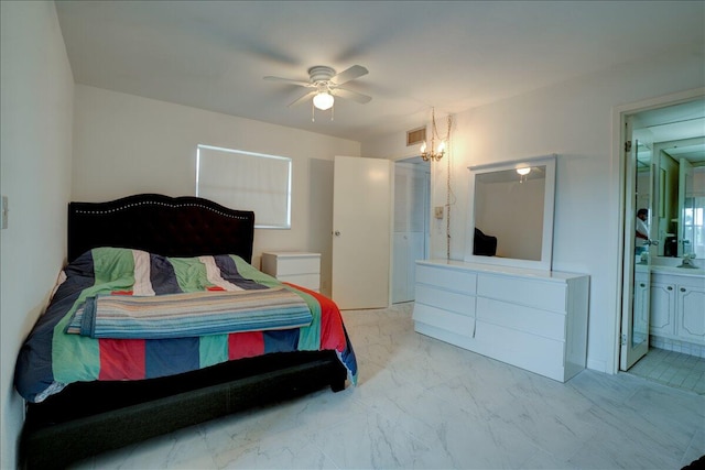 bedroom with ensuite bathroom and ceiling fan