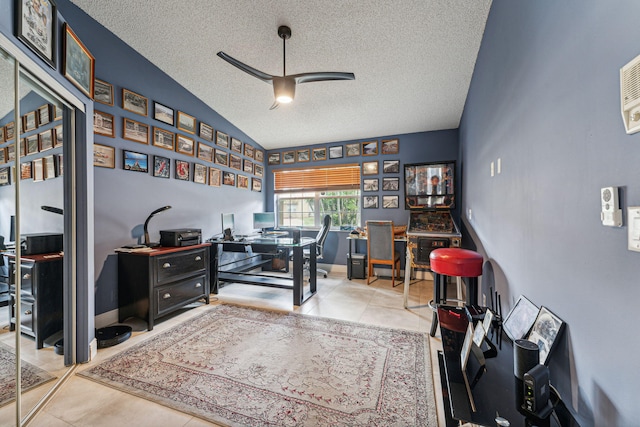 tiled office space with lofted ceiling, ceiling fan, and a textured ceiling