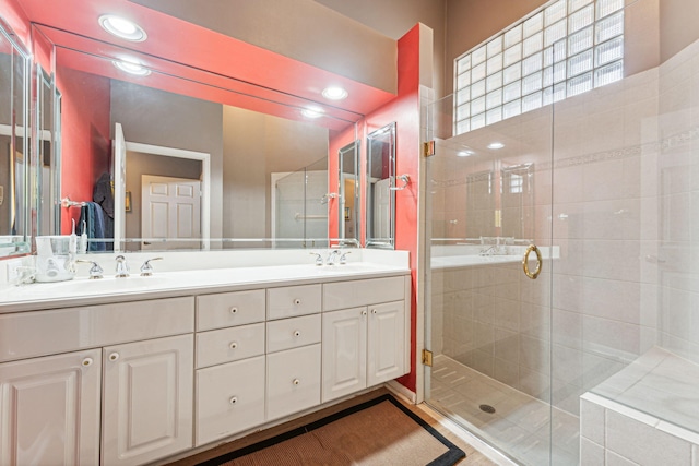 bathroom with vanity and plus walk in shower