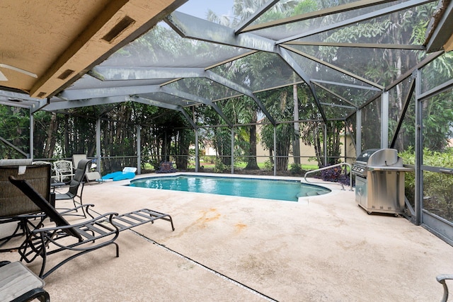 view of pool featuring a patio, grilling area, and a lanai