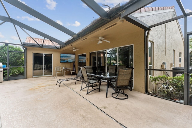 sunroom / solarium featuring ceiling fan and vaulted ceiling