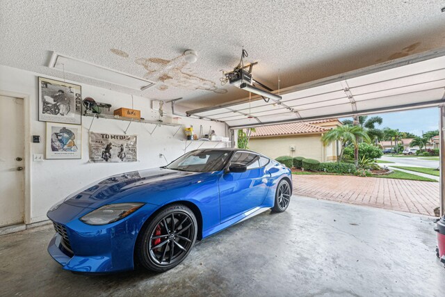 garage featuring a garage door opener