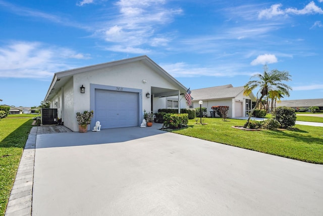 ranch-style home featuring a garage and a front lawn