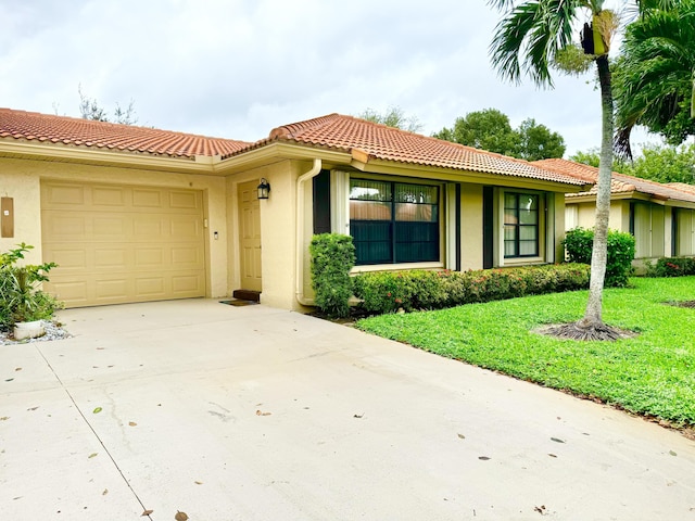 view of front facade featuring a garage, stucco siding, a front yard, concrete driveway, and a tiled roof