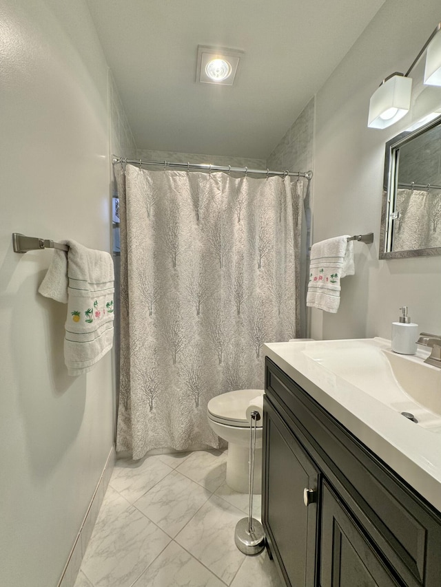 full bathroom with vanity, marble finish floor, a shower with shower curtain, and toilet