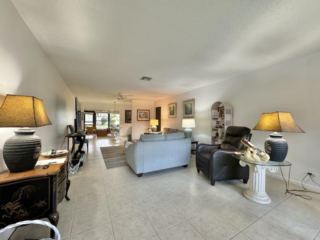 tiled living room with a textured ceiling