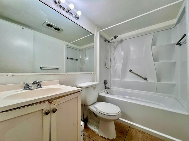 full bathroom featuring toilet, vanity, tile patterned floors, and  shower combination