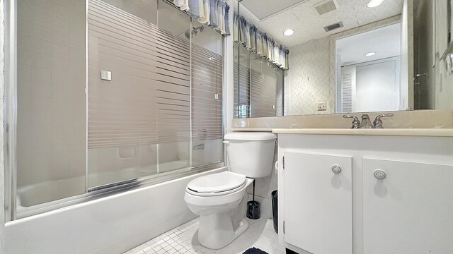 bathroom with toilet and an enclosed shower