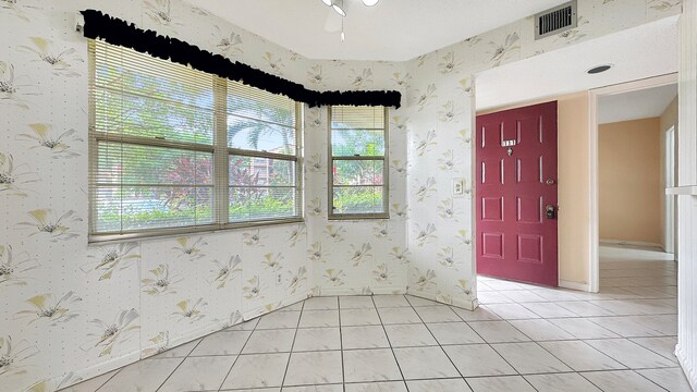 foyer entrance with light tile patterned flooring