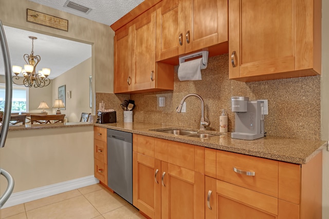 kitchen with a textured ceiling, stainless steel dishwasher, light tile patterned flooring, a notable chandelier, and sink