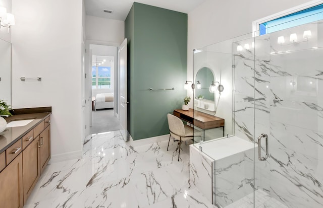 ensuite bathroom featuring a healthy amount of sunlight, ensuite bath, vanity, and a marble finish shower