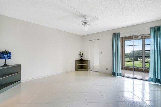 unfurnished room featuring a textured ceiling and ceiling fan