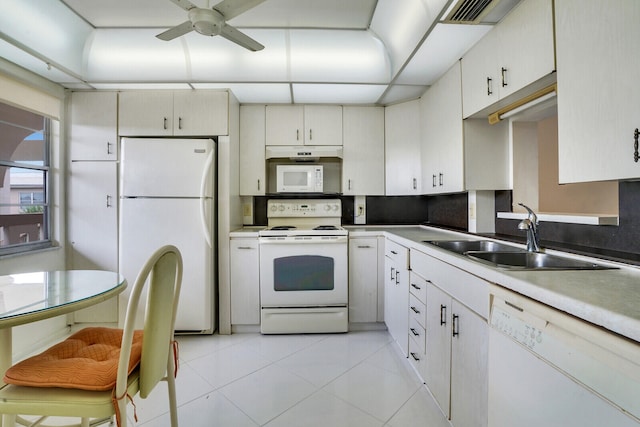 kitchen featuring light tile patterned floors, sink, white appliances, and ceiling fan