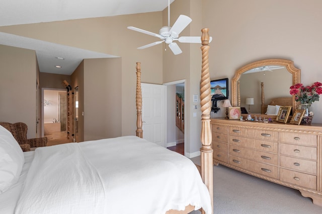 carpeted bedroom featuring ensuite bathroom, high vaulted ceiling, and ceiling fan