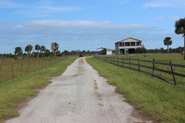 back of property featuring a balcony