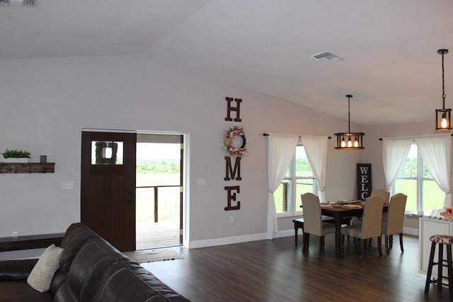 dining area featuring a notable chandelier and dark hardwood / wood-style floors