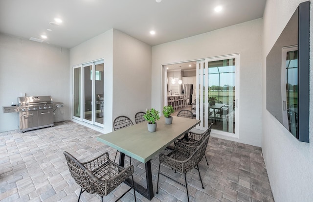 10574 Northbrook Cir Unit Prestige 049, Palm Beach Gardens, FL 33412 - view of patio / terrace with area for grilling and outdoor dining space